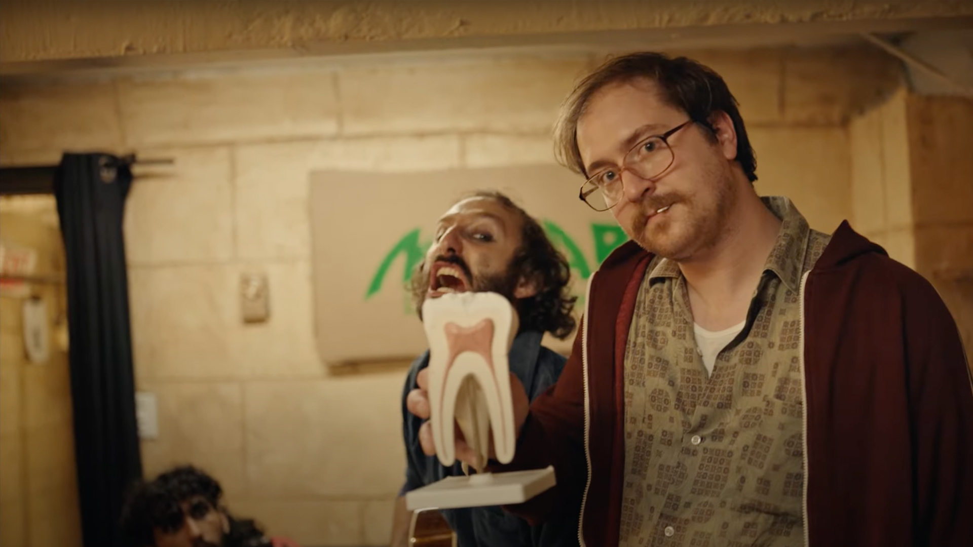 2 men with tooth figure