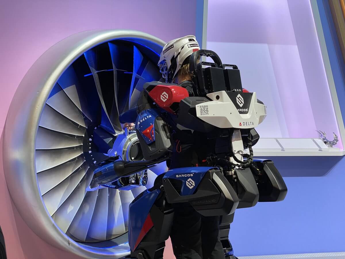 tech suit in front of fan