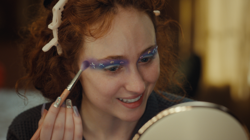 woman applying makeup