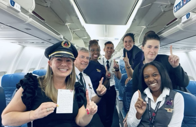 a group of smiling people on an airplane